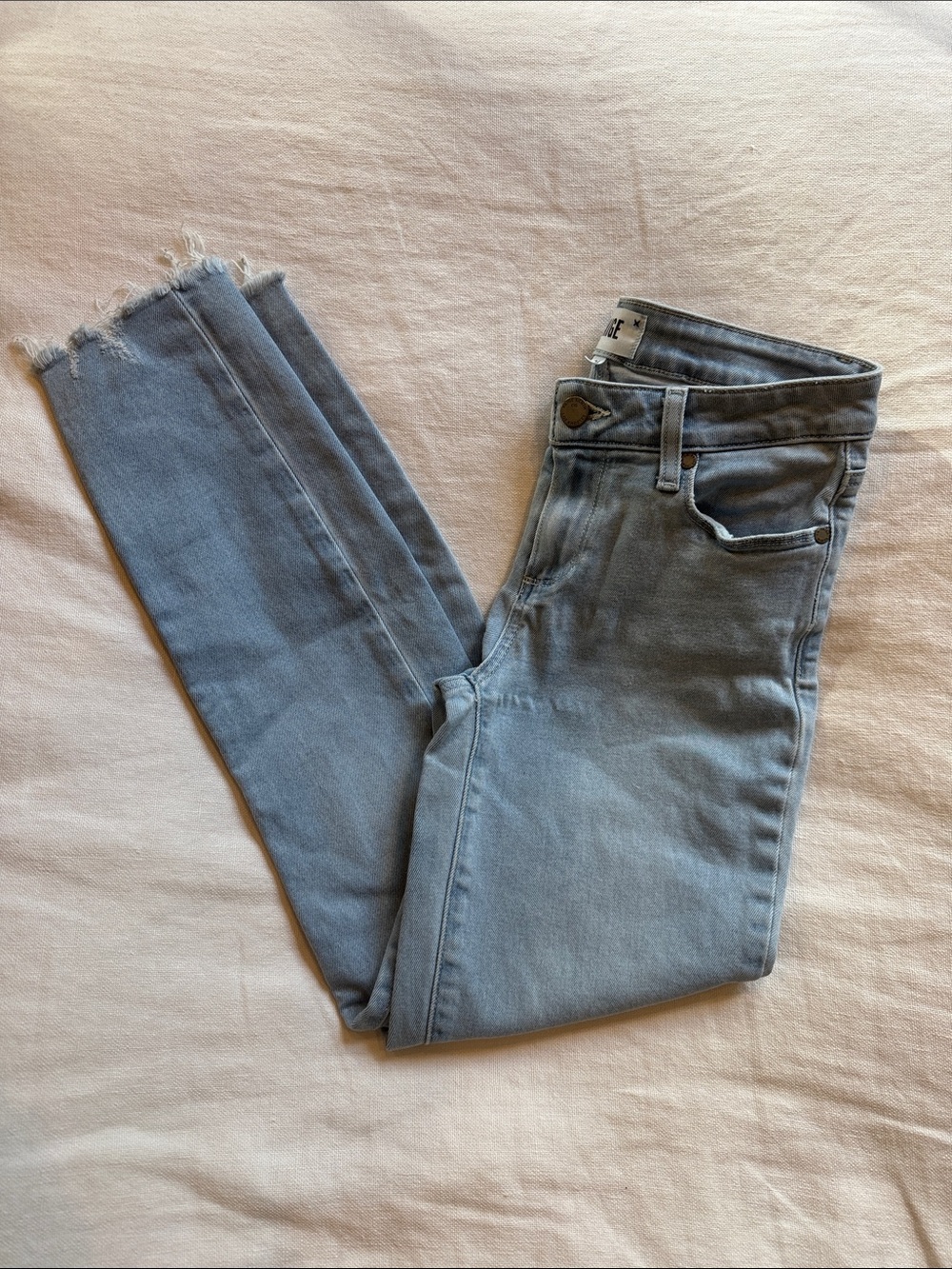 PAIGE Light Wash Skinny Jeans with Frayed Hem